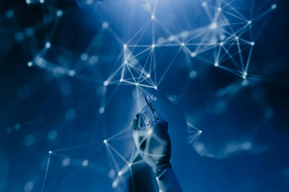 A robotic hand reaching into a digital network